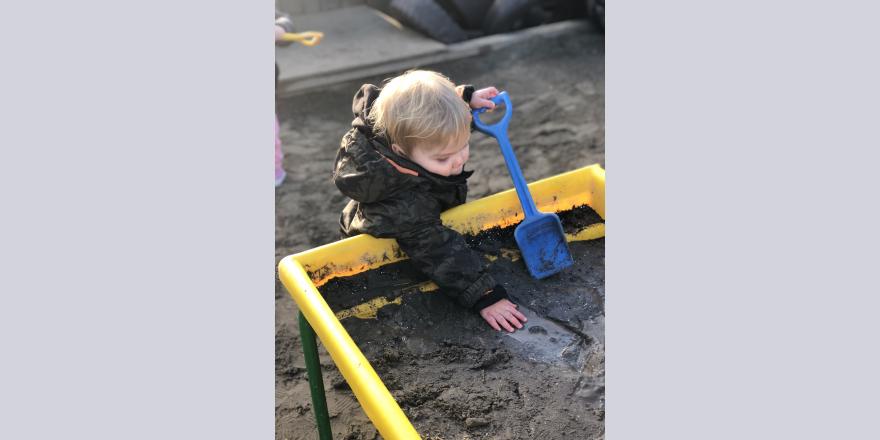 Digging in the sandpit at preschool