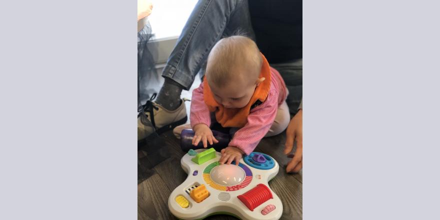 Baby playing with interactive toys