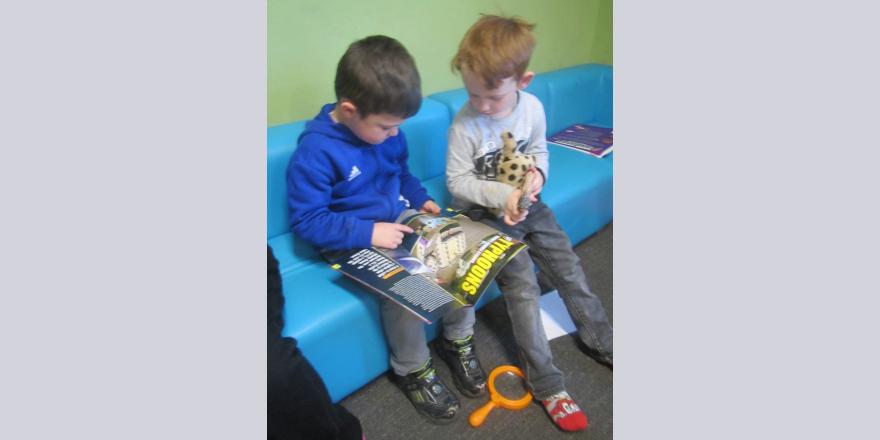 Boys reading together at Ragiora preschool