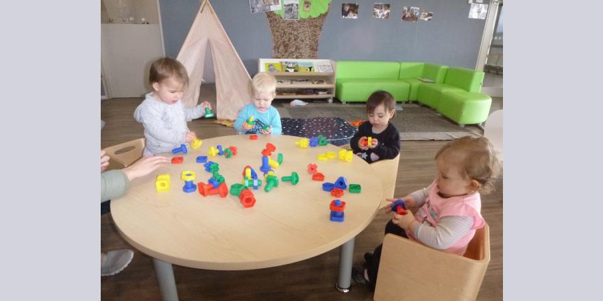 Kids playing with building blocks at preschool