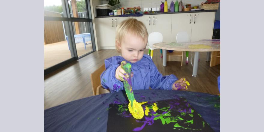 Playing with paint at preschool